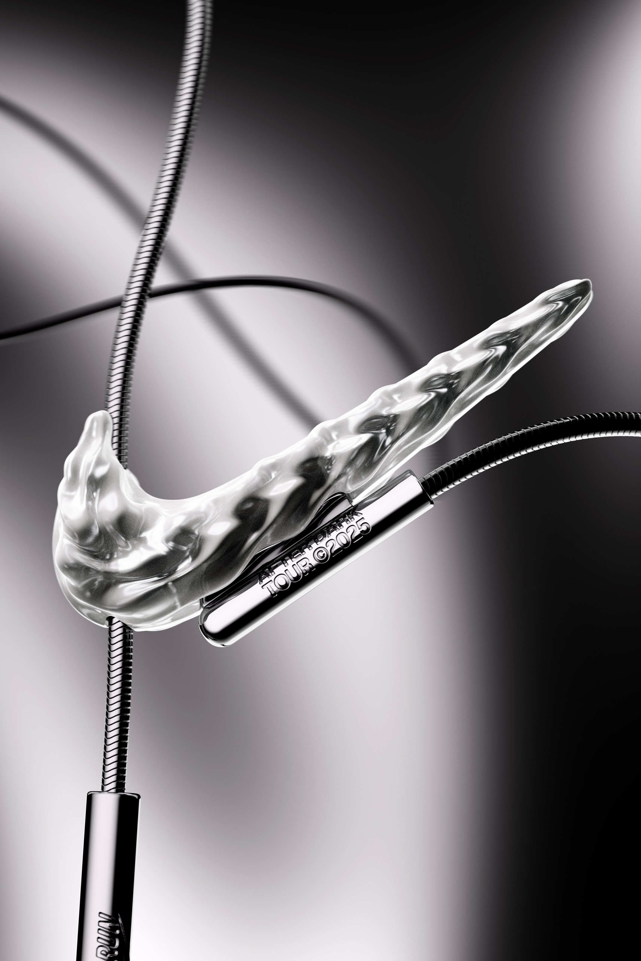 Macro detail of the Nike After Dark Tour pendant — a sculpted metal Swoosh on its chain, engineered in Bassano del Grappa