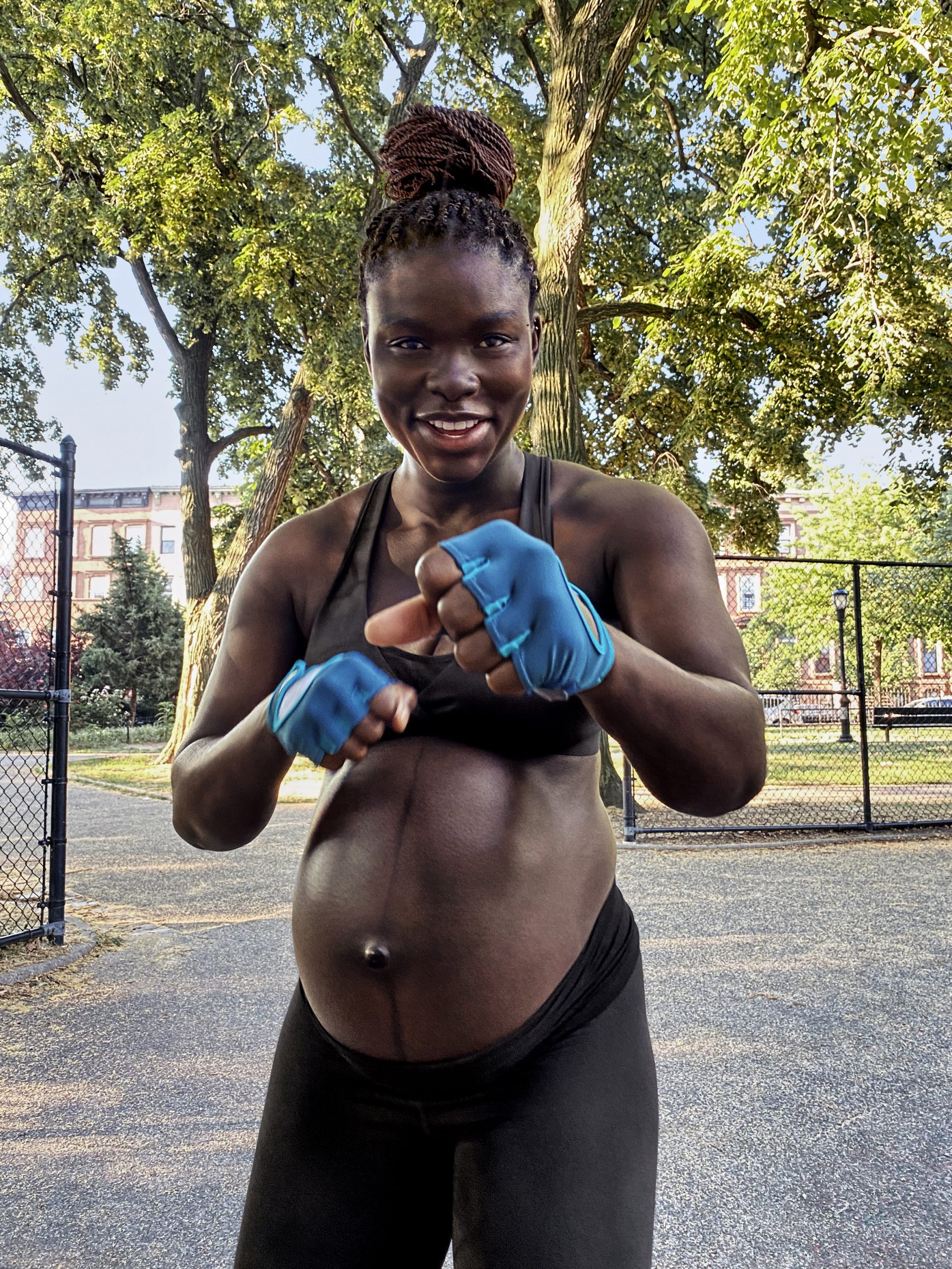 Athlete training during pregnancy wearing Nike (M) performance apparel